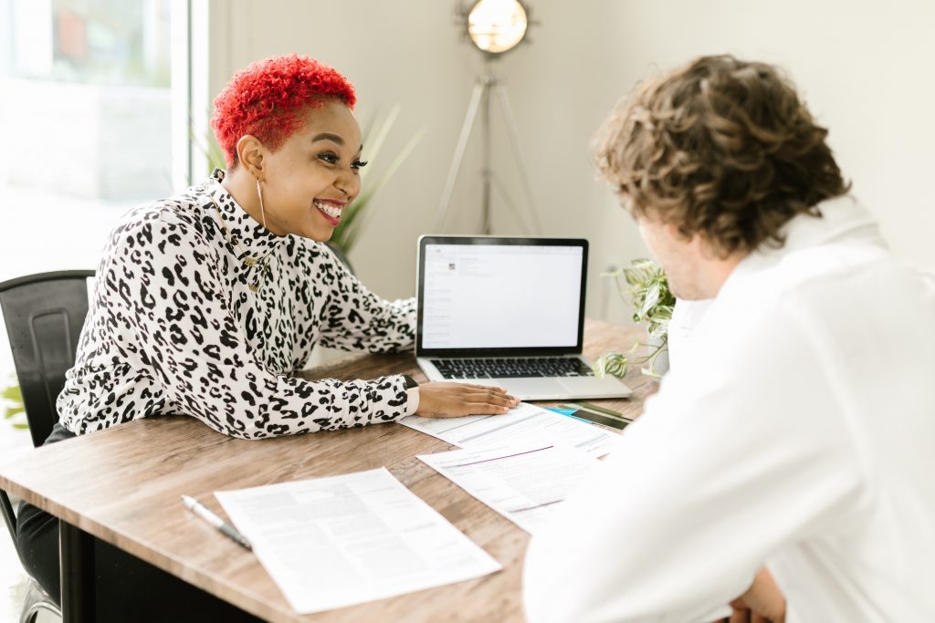 insurance agent reviewing policy with client