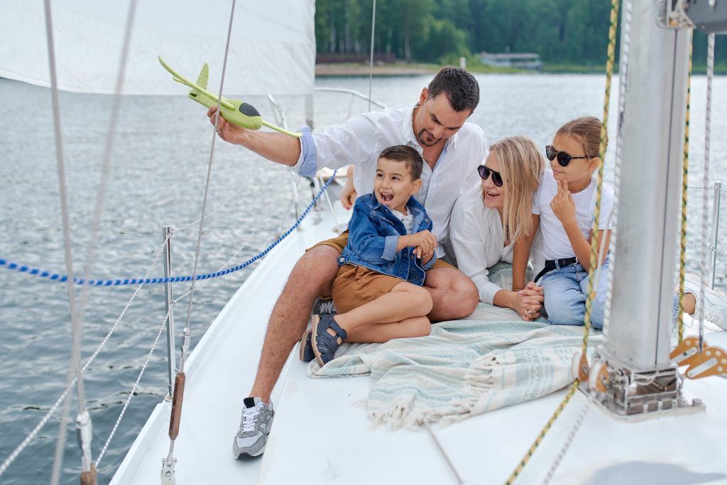 family smiling on boat