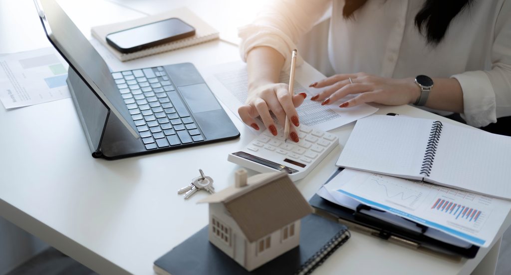 a woman with a contract in front of her for homeowners insurance